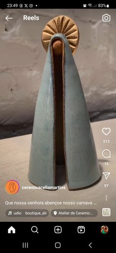 a blue vase sitting on top of a table