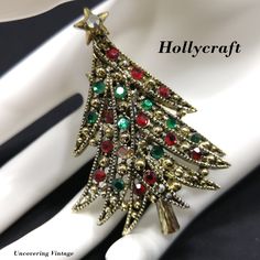 *Description: This is a beautiful Hollycraft "Ribbon Tree" brooch from the 1950s. This brooch is featured in Mary Morrison's Christmas Jewelry book on page 43. She explains the brooch is sometimes called the ribbon tree for its many layers of long, curved, ribbon-like branches, each adorned with alternating stones and knobs. The Hollycraft stamp on the back with a copyright in front dates this piece at 1955 or after. There is one missing flat back red rhinestone which could easily be replaced if Vintage Red Brooches For Festive Occasion, Vintage Christmas Jewelry For Celebration, Vintage Christmas Celebration Jewelry, Vintage Holiday Jewelry For Party, Vintage Jewelry For Holiday Parties, Vintage Holiday Party Jewelry, Holiday Party Vintage Jewelry, Vintage Handmade Holiday Jewelry, Handmade Vintage Jewelry For Holidays