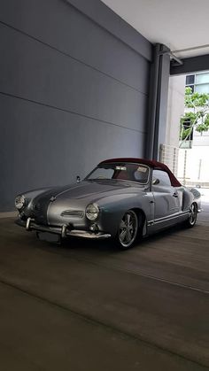 an old car parked in front of a building