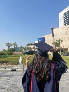 a woman wearing a graduation cap and gown