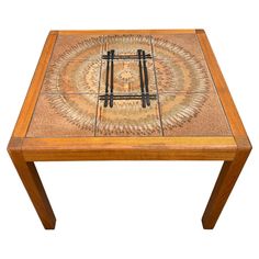 a wooden table with an intricate design on it