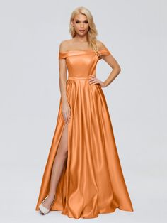 a woman wearing an orange satin gown with thigh high slits and off - the - shoulder