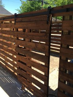 a wooden fence that has been made out of pallets