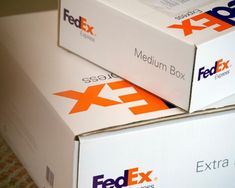 two fedex boxes stacked on top of each other