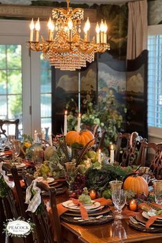 a dining room table set for thanksgiving dinner