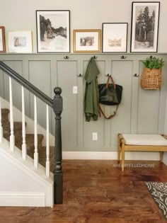 the stairs are lined with pictures and purses