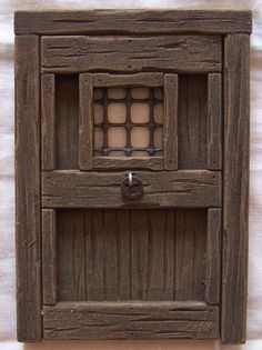 an old wooden cabinet with glass doors