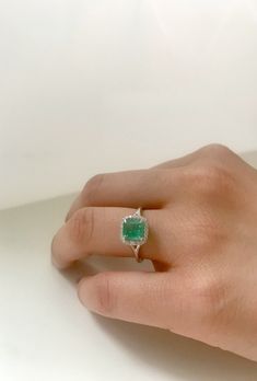 14k Gold, Micro Pave, Diamond Halo, Colombian Emerald ring. This fine statement ring would make a perfect gift for any occasion it can also be used as a stunning engagement ring. The Diamond halo along with the claw setting gives this ring it a chic yet classic look so that you turn heads where ever you go. Center stone: Colombian Emerald Centerstone weight: 1.20 ct Diamond halo: .15G color white diamond, VS clarity. Ring Size: Adjustable Made in: New York City Made to order If required, please Colombian Emerald Engagement Ring, Diamond Emerald Ring, Emerald Stone Rings, Colombian Emerald Ring, Anklet Tattoos, Claw Setting, Stunning Engagement Ring, Colombian Emeralds, Emerald Stone