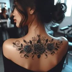 a woman with a tattoo on her back