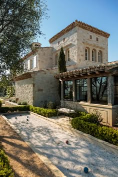 a large house with a stone walkway leading to it