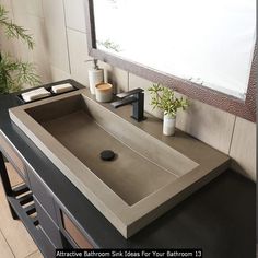 a bathroom sink sitting under a mirror next to a counter top with a phone on it