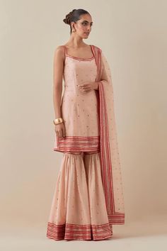 Peach kurta with aari, zari, sequin embroidery. Paired with gharara and dupatta. - Aza Fashions Fitted Peach Sharara For Diwali, Peach Sharara For Diwali, Festive Peach Designer Sharara, Peach Sharara With Mirror Work For Diwali, Designer Festive Peach Sharara, Designer Peach Sharara With Dori Work, Peach Fitted Sharara For Diwali, Festive Designer Peach Sharara, Peach Sharara For Diwali Reception