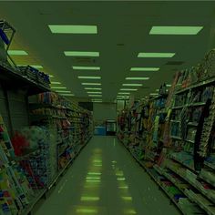 an empty grocery store aisle filled with lots of items