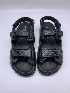 Chanel leather CC 'Dad' Sandals. Unworn & 100% authentic guaranteed. Supplied in its original packaging. DETAILSBlack CC.Black.Leather.Velcro Strap.Made in Italy. Need assistance? Use our Sourcery service or chat to a member of our team via WhatsApp Basket New Balance, House Of Chanel, Dad Sandals, Fashion Chanel, Chanel Official, Chanel Official Website, Fashion Buyer, Comfy Shoes, Timeless Handbag