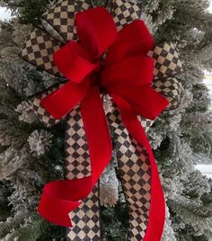 a christmas tree with a red bow on it