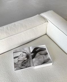 a white couch with a black and white photo on it