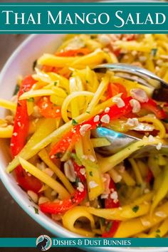 the cover of thai mango salad is shown with a fork in it's bowl