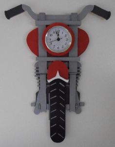 a clock mounted to the side of a motorcycle