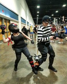 two people dressed up in costumes and helmets