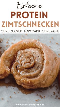 a close up of some food on a piece of paper with the words enfache protein zimtschnecken