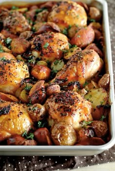 a casserole dish filled with chicken and potatoes