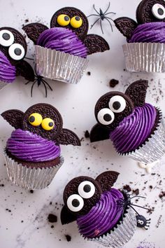 cupcakes decorated with purple frosting and googly eyes