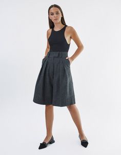 High-waisted knee-length shorts IPANTS.A wide waistband along with front pleats highlight the waist and make it visually thinner. Bermuda shorts are made from 100% striped wool in dark grey color and have an extra lining to be more pleasant to the body. Shorts have comfortable side pockets and faux pockets on the back. Belt loops, zip, and hook-and-eye closures on the middle.Composition: 100% woolLining: 100% viscoseCare: We recommend a professional dry clean. Do not wash. Do not bleach. Do not Gray Pleated Short Skirt, Pleated Knee-length Shorts For Work, Knee-length Pleated Waist Bottoms For Work, Gray Workwear Shorts, Elegant Gray Short Length Bottoms, Chic Gray Knee-length Bottoms, Gray Knee-length Workwear Bottoms, Gray Knee-length Bottoms For Workwear, Body Shorts