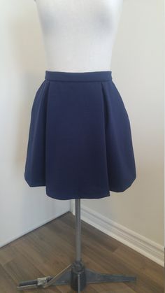 "This pattern is for a flared skirt with box pleats. It features a zippered opening in back and side seam pockets. It is suitable for many types of woven and non-stretch fabric. You will receive 2 digital files, including an A4 printable pattern in sixes XS to XL, and full colour instructions. This pattern is great for beginners, and will teach you to sew a zipper, pockets, waistband and pleats. THIS PDF SEWING PATTERN INCLUDES:  **Printable PDF Patterns in A4 (print at home) and A0 (print at copy shop) format.         All seam allowances are included and there are instructions for printing all sizes together or only the size         you need in Adobe Acrobat Reader (free app) **Full Colour Instructions       The instructions are professionally formatted and include color photos and illust Box Pleat Skirt Pattern, Pleat Skirt Pattern, Sew A Zipper, Pleated Skirt Pattern, Sewing Projects Ideas, Sew Zipper, Box Pleat Skirt, Pleat Skirt, Pleated Skirts