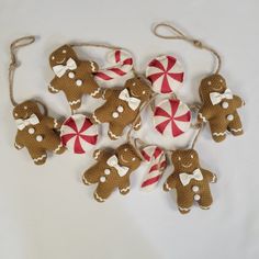 a group of gingerbread christmas ornaments with candy canes