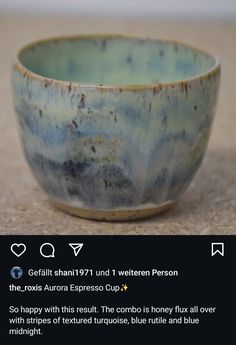 a blue and white bowl sitting on top of a table