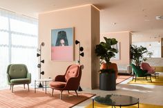 a living room filled with lots of furniture and plants on top of it's walls