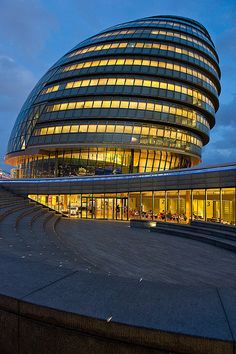 the building is lit up at night and it looks like something from another place in the world