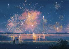 fireworks are lit up in the night sky over water and beach with people standing on shore