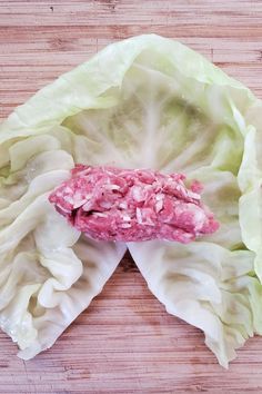 lettuce with meat in it on a cutting board