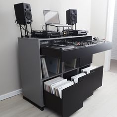 there is a dj's desk with two turntables on it