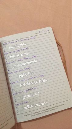 an open notebook with writing on it