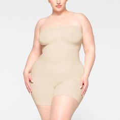 This strapless shortie solution is perfect for cinching your waist, holding in your tummy and core, and smoothing your thighs under mini skirts and dresses. Features pique stitching that supports your bust, an open gusset, and removable adjustable straps that you can wear as shoulder straps, cross back, or as a halter. | SKIMS Strapless Shortie Bodysuit | Light Neutral | Seamless Sculpt Bridal Shapewear, Skirts And Dresses, Sand Color, Lingerie Sleepwear, Chic Design, And Dresses, Shapewear, Shoulder Straps, Dress Skirt