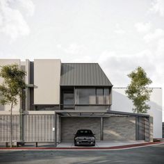 a car is parked in front of a modern house with white walls and grey roof