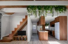 a living room filled with furniture next to a staircase