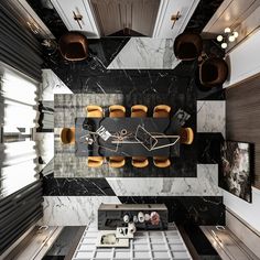 an aerial view of a dining room with marble walls and flooring, along with modern furniture