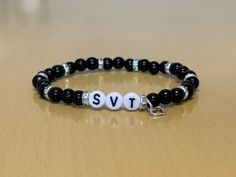 "⚠️Warning ⚠️ WE DO NOT SHIP TO GERMANY! Hi welcome to our new mini business!! What we are selling here is a classy Seventeen/Carat bracelet.  These are some of the best features about our product: Bead Type: Glass Pearl (size- 6mm) 9 Crystal Spacers  1 Open Heart Charm Alphabet beads  Strong Elastic Has Bead Glue for extra safety Packaging: Free NON official photocard with pouch  Free mini disk with group name on organza bags  The inspiration behind this product came from having a lot of kpop friends all around the world and I wanted to gift them something special for christmas. My mum used to make bracelets back in the day and I came up with an idea to hand-make my friends bracelets with my mums help. I found out by doing this activity that I really enjoyed the progress of making them. M Carat Bracelet Seventeen, Seventeen Inspired Beaded Bracelet, Seventeen Bracelet Ideas, Seventeen Bracelet, Kpop Seventeen, Diy Kandi Bracelets, Diy Kandi, Mini Business, Kandi Bracelets