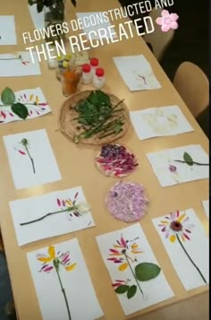 the table is covered with paper and flowers