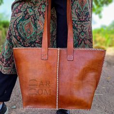 Leather Bag Handmade Bag Brown Bag ## Product Characteristics ## -Dimension :(11.80H * 15.35W)inch [30H * 39 W cm ] -Color : Brown -Material: 100 % genuine leather -100% Handmade This bag is handcrafted from high quality goat leather. The leather we use is treated with natural materials that make the leather has no unpleasant smell. This bag is the best choice for you , because it is very comfortable and durable. ##Note ## We still need your phone number for the shipping company can you please send it! Large Canvas Shoulder Bag For Shopping, Large Rectangular Satchel For Shopping, Large Square Shoulder Bag For Everyday, Large Brown Travel Bag, Large Double Handle Bag For Everyday Use, Large Brown Rectangular Bag, Large Rectangular Brown Bag, Large Brown Bags With Double Handle, Large Rectangular Hobo Bag For Daily Use