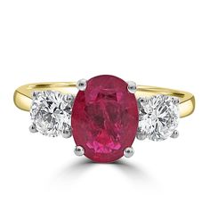 an oval ruby and diamond three stone ring