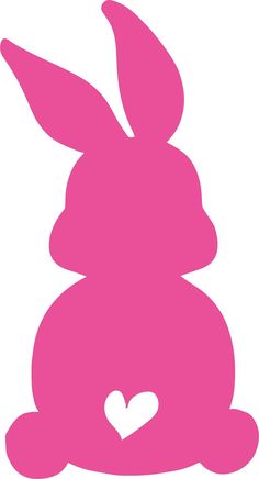 a pink bunny with a heart on its chest sitting in front of a white background