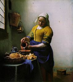 a woman pouring water into a bowl on top of a table next to bread and other foods