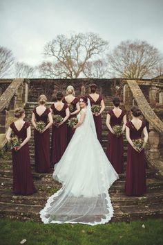 a bride and her bridals standing on the steps