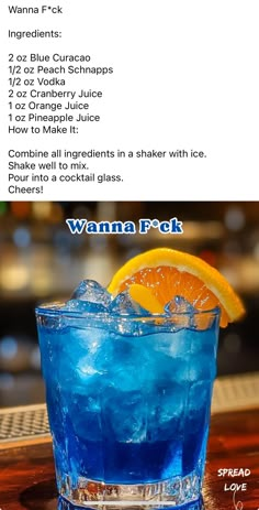 a blue drink with an orange slice in it