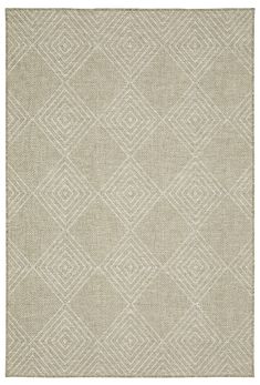 a beige rug with diamond shapes on it