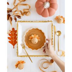 a person is decorating a thanksgiving turkey plate